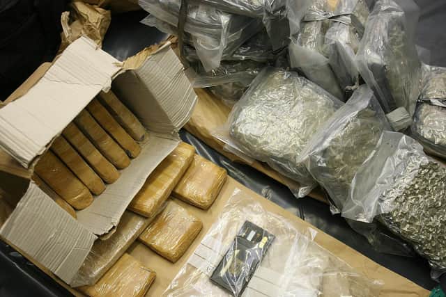 Part of a massive seizure of heroin and arms by Gardai forensic officers in Dublin's Garda Technical Bureau headquarters. PA