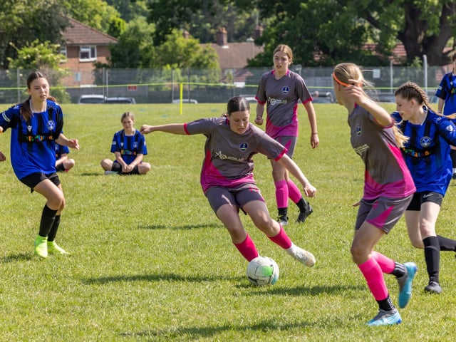City Ladies (pink/grey kit) versus Clanfield Girls (blue) in the Clanfield youth football tournament at Horndean Technology College. Picture: Mike Cooter
