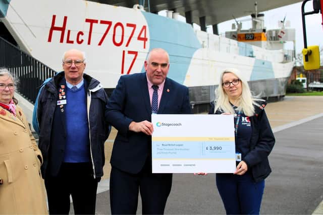 Portsmouth Depot Manager, Colin Ashcroft hands £3990 cheque to the Royal British Legion