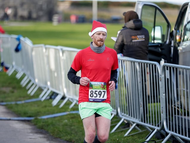 Jim Carrington crossed the line first in the Southsea 5K.  Picture: Chris  Moorhouse (221224-65)