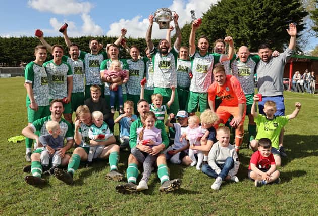 Mob Albion celebrate with their families after retaining the Father Purcell Challenge Cup. Picture: Kevin Shipp