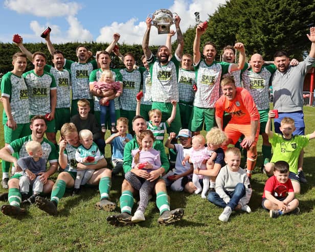 Mob Albion celebrate with their families after retaining the Father Purcell Challenge Cup. Picture: Kevin Shipp