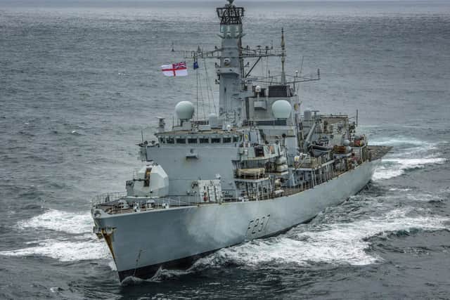 HMS Westminster charged to the rescue of a father and son after their ship sunk. Photo: Royal Navy