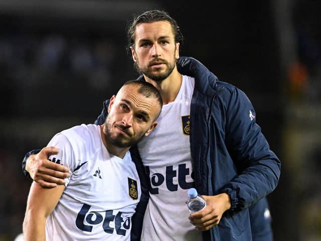 Ex-Pompey favourite Christian Burgess is set to miss out on the Jupiler Belgium Pro Division title but his Champions League hopes remain alive.