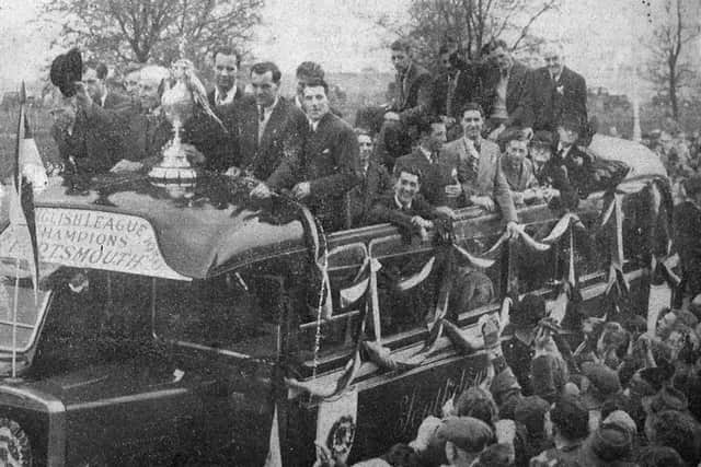 Pompey celebrate their Division One title triumph during an open-top bus parade.
