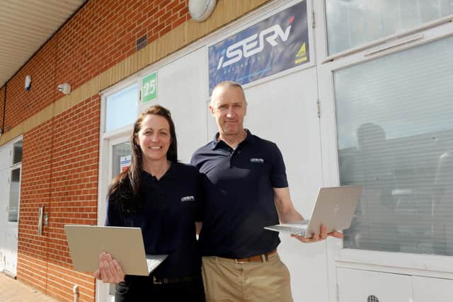 Directors Elliot and Lynda Potter of iServ Mechanical Limited in Waterlooville have donated five laptops to MYTIME charity for young carers. Picture: Sarah Standing (220321-5246)