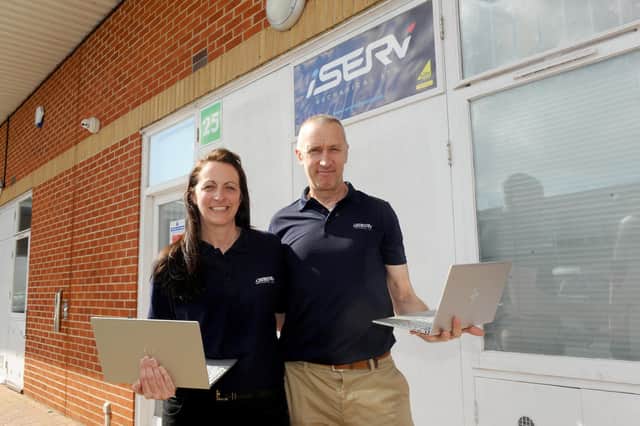 Directors Elliot and Lynda Potter of iServ Mechanical Limited in Waterlooville have donated five laptops to MYTIME charity for young carers. Picture: Sarah Standing (220321-5246)