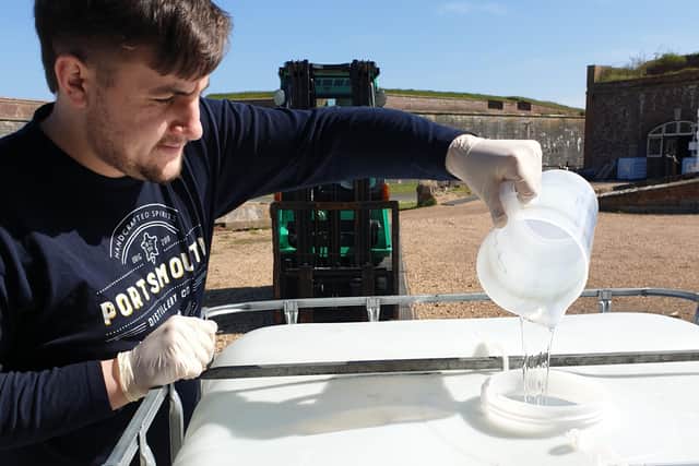 Joshua Collighan making hand sanitiser at the Portsmouth Distillery in Fort Cumberland, Portsmouth. Picture: Portsmouth Distillery