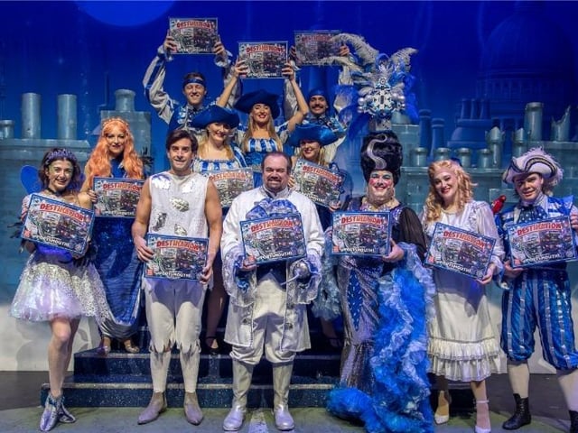 Panto cast of Hook at The Kings Theatre with Destination Portsmouth board game