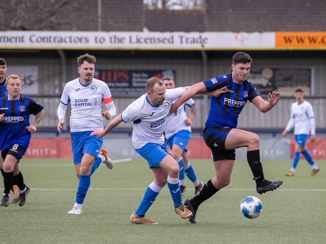 Clanfield (blue) v Andover New Street Swifts. Picture by Alex Shute
