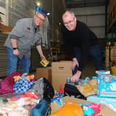 Pictured is: (l-r) Terry Buckel (50) and Steve Holland (55) with just a handful of the supplies which have been donated.
Picture: Sarah Standing (040322-217)