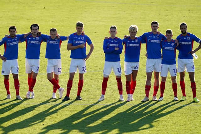 Pompey players stand on the halfway line during the penalty shoot-out. Picture: John Walton/PA Wire
