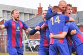 Harry Birmingham (second right) celebrates after US Portsmouth scored a late second goal in their Vase quarter-final win against Flackwell Heath. Picture: Martyn White.