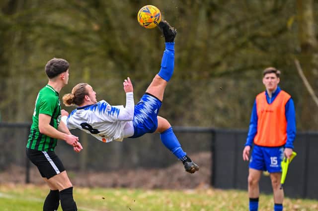 Jake Knight executes an overhead kick during Clanfield's win at Andover New Street Swifts. Picture by Richard Murray