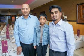 Gandhi Indian restaurant in Portsmouth has recently been taken over by Ash Haque and has undergone a renovation. A new menu has also been launched as part of the take over. Pictured: Owner Ash Haque with his son, Riaz 4 and Ash's brother RayanPicture: Habibur Rahman