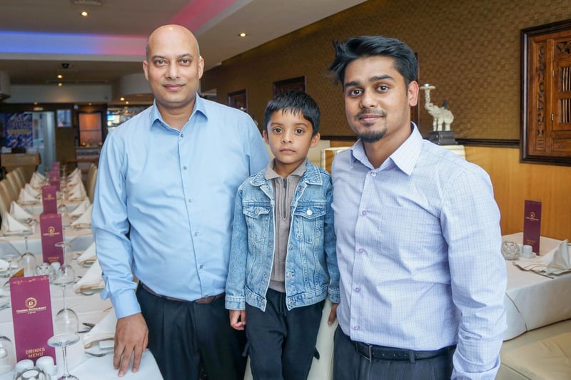 Gandhi Indian restaurant in Portsmouth has recently been taken over by Ash Haque and has undergone a renovation. A new menu has also been launched as part of the take over. Pictured: Owner Ash Haque with his son, Riaz 4 and Ash's brother RayanPicture: Habibur Rahman
