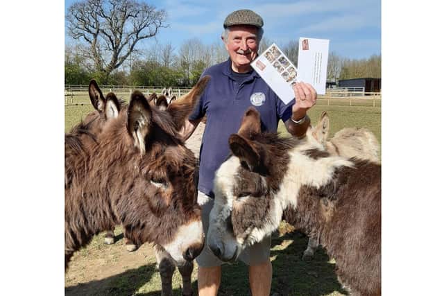Hayling Island Donkey Sanctuary received a donation from patron and good friend John 'Boycie' Challis and TV co star Sue 'Marlene' Holderness to boost their fundraising. Pictured: Volunteer Phill Upshall with a couple of donkeys and the signed items