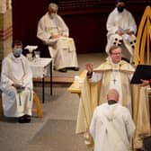 Bishop Christopher Foster and the Rev Bryan Stephenson (centre) with Archdeacon of Portsdown the Ven Jenny Rowley (left) and area dean of Portsmouth Canon Bob White (right - holding the folder), at St Luke's Church, Southsea