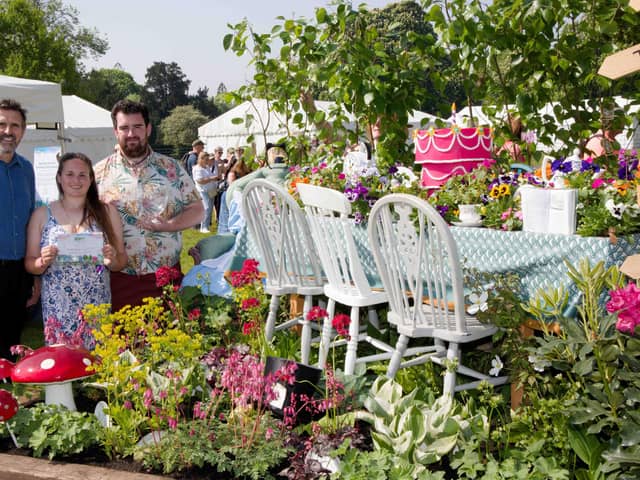 Winners of the ‘best in show’ Beautiful Border and Platinum award at the BBC Gardeners’ World Spring Fair 2025, Briony and Jonathan Dakic for The 160th Unbirthday of Alice in Wonderland, pictured with Adam Frost.