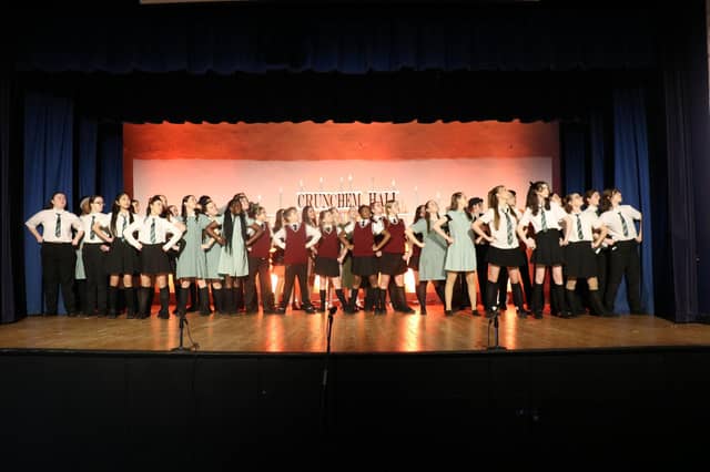 The cast of 'Matilda Jr: The Musical posed on stage
