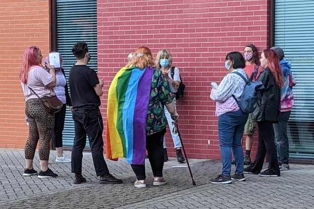 Protesters chant 'trans rights are human rights' outside the University of Portsmouth's Richmond Building.