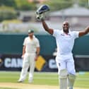 Michael Carberry celebrates scoring a century against Australia A during England's tour match at the Bellerive Oval in Hobart in November 2013. Picture: William West/AFP via Getty Images.