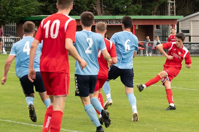 Tommy Tierney scores on his league debut for Horndean in their win against Poppies. Picture: Keith Woodland