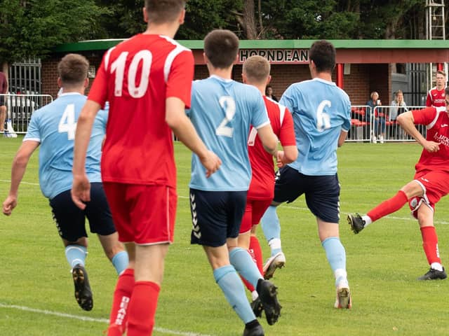 Tommy Tierney scores on his league debut for Horndean in their win against Poppies. Picture: Keith Woodland