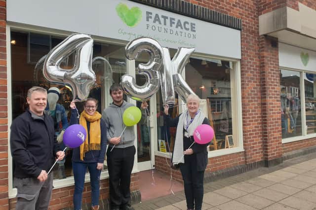 Representatives from StepbyStep, one of the charities helped by the Fatface Foundation, at its existing store in Havant