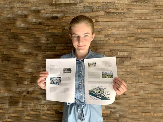 Amelie Van Gelder, 13, with the plans for her winning sustainable city design.