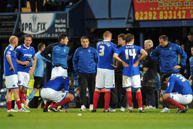 Steve Cotterill speaks to his players on the pitch after their 3-0 defeat against Coventry in 2011. Picture:Steve Reid