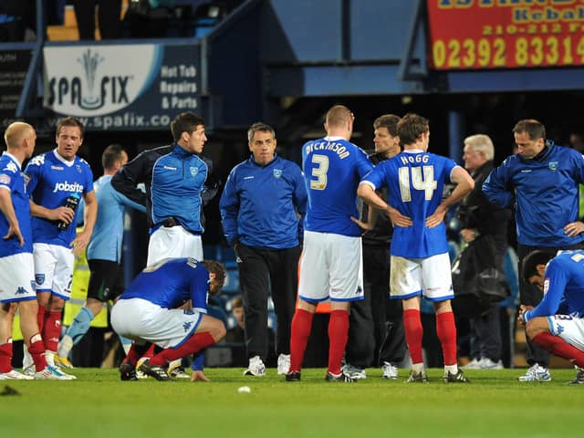 Steve Cotterill speaks to his players on the pitch after their 3-0 defeat against Coventry in 2011.  Picture:Steve Reid