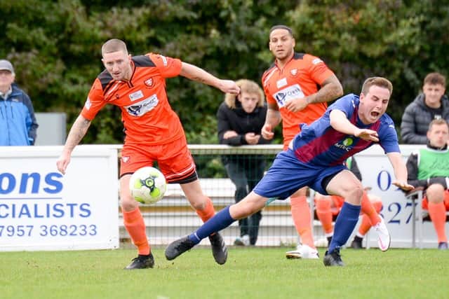 AFC Portchester striker Lee Wort, left, in action during his side's FA Vase loss to US Portsmouth. Pic: Martyn White.