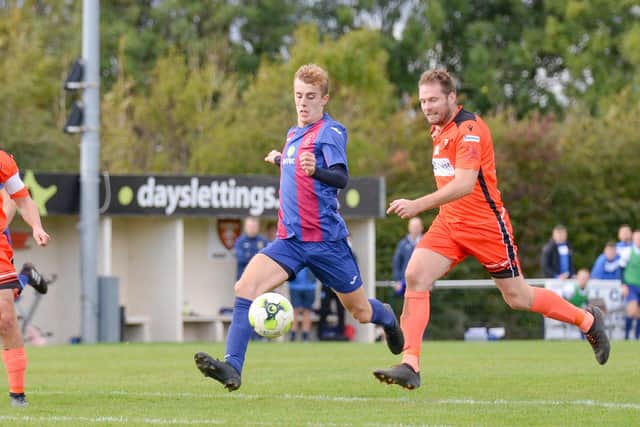 James Franklyn of US Portsmouth about to get a shot in during his side's FA Vase win against AFC Portchester. Picture: Martyn White.