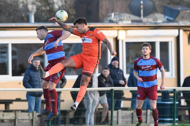 Pete Castle goes up for a header during Portchester's 4-0 home Wessex League loss to Hamworthy United at the weekend. Picture: Keith Woodland