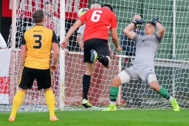 Fareham's Ross Kidson heads his side into the lead against Baffins. Picture: Martyn White.