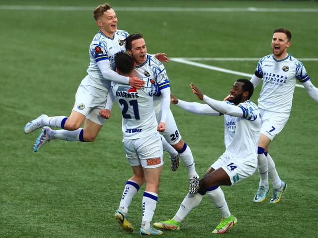 Sam Matthews is about to be mobbed after scoring Hawks' late winner. Picture by Dave Haines