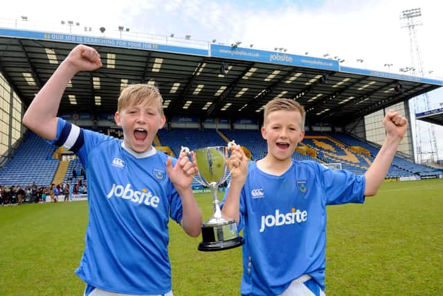 Tommy Leigh, right, with Priory School team-mate Harvey Tanner after they won the U-13 Schools' Cup at Fratton Park in 2013. Picture: Ian Hargreaves  (131225-1)