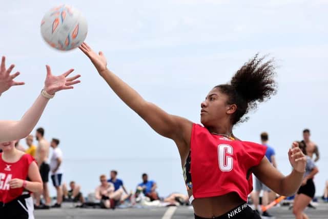 Reaching for the sky: netball was one of the sports being played on HMS Queen Elizabeth's flight deck over the weekend. Photo: Royal Navy/Twitter