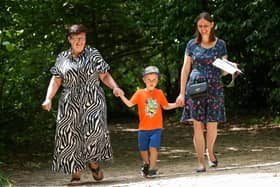 Angela Larkman, Thomas, 5, and his mother, Kay Larkman enjoy a stroll in the sun at Holly Hill Woodland Park