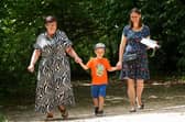 Angela Larkman, Thomas, 5, and his mother, Kay Larkman enjoy a stroll in the sun at Holly Hill Woodland Park