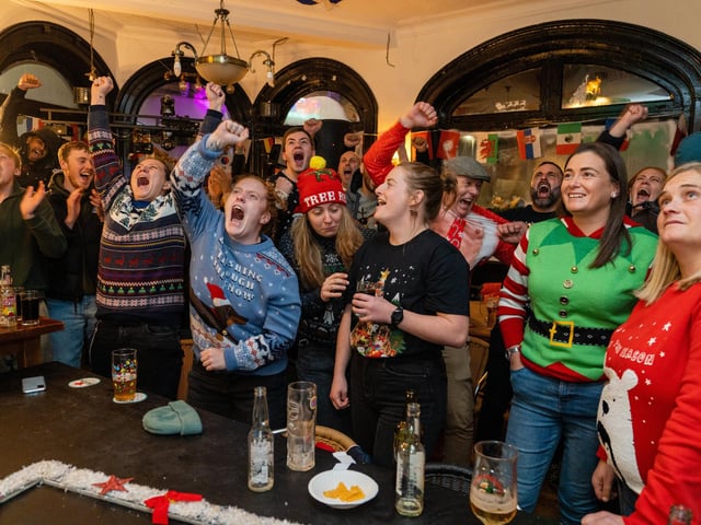 England fans celebrating Harry Kane's penalty at The Kings in Southsea. Picture: Matthew Clark