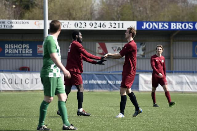 Jesse Parkis (left) congratulates Jack Palmer on his goal that gave Burrfields the lead against Mob Albion. Picture: Allan Hutchings