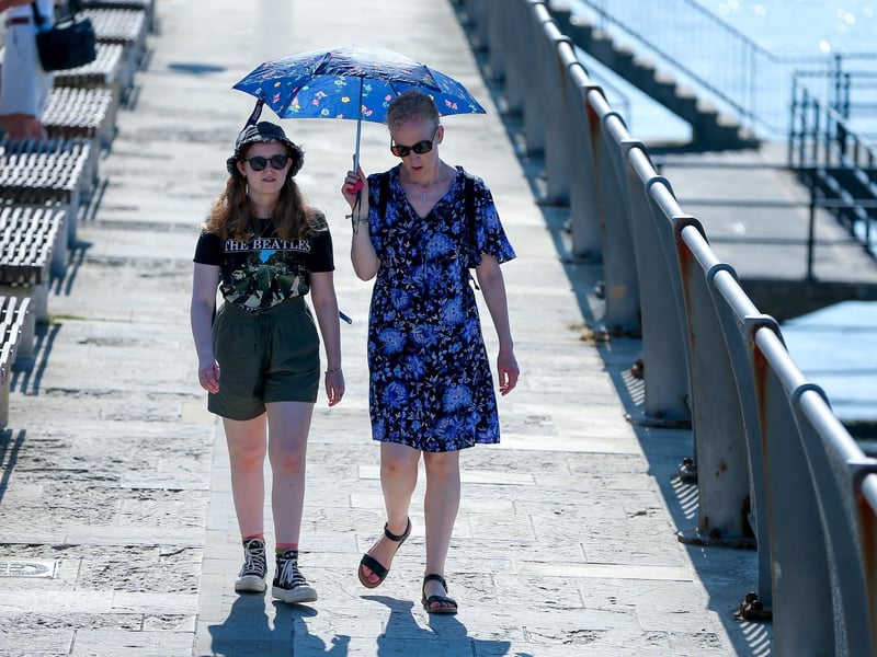Creating some shade as they walk, Hotwalls, Old Portsmouth
Picture: Chris Moorhouse (jpns 090923-09)