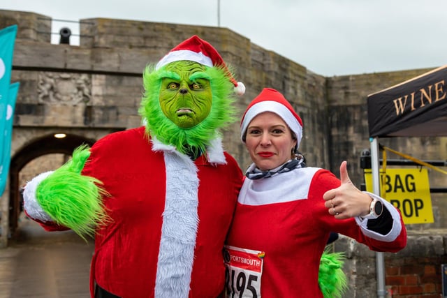 Grinch Ewan Crooks (41) and Victoria Hedges (36) all ready for the Festive Half Marathon starting from Southsea Castle. Picture: Mike Cooter (181222)