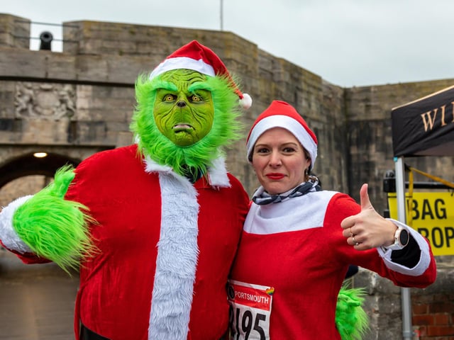 Grinch Ewan Crooks (41) and Victoria Hedges (36) all ready for the Festive Half Marathon starting from Southsea Castle. Picture: Mike Cooter (181222)
