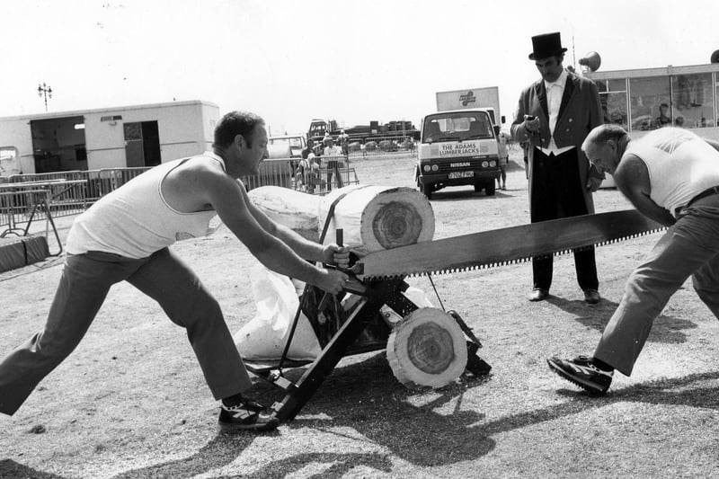 The Adams Lumberjacks try to beat a record for cutting a log the fastest at Southsea Show in 1989. The News PP4116