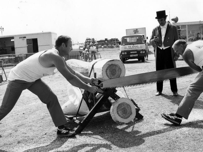The Adams Lumberjacks try to beat a record for cutting a log the fastest at Southsea Show in 1989. The News PP4116