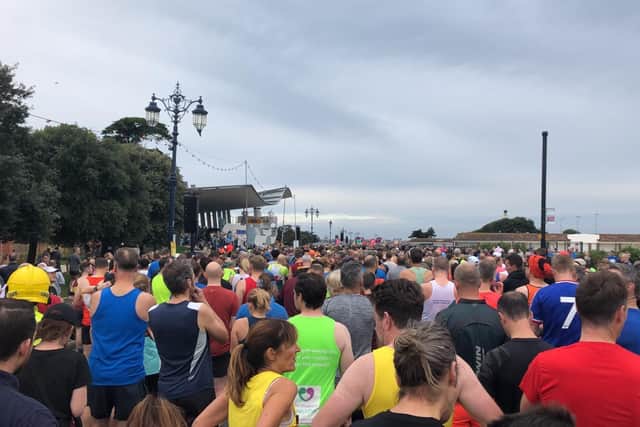 Elite runners, club runners and those in the orange wave get ready to set off