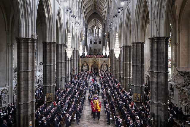 Senior royals follow behind the coffin of Queen Elizabeth II, draped in the Royal Standard with the Imperial State Crown and the Sovereign's orb and sceptre, as it is carried out of Westminster Abbey after her State Funeral. Photo by Danny Lawson - WPA Pool/Getty Images